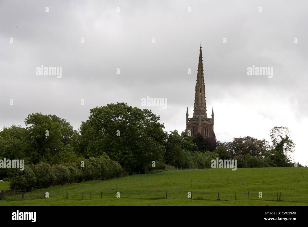 All Saints Church, Braunston, Viewed from the field on the bank of the Oxford Canal. Stock Photo