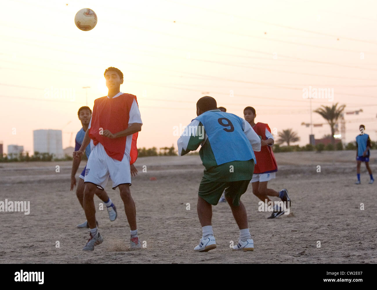 Dubai, men playing football Stock Photo Alamy