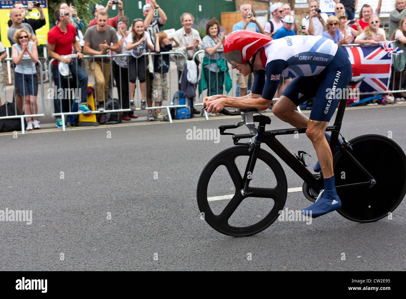 Olympic Mens Cycling Time Trial London 2012. Bradley Wiggins passes crowds in Hampton Wick on his way to winning the Gold Medal. Stock Photo