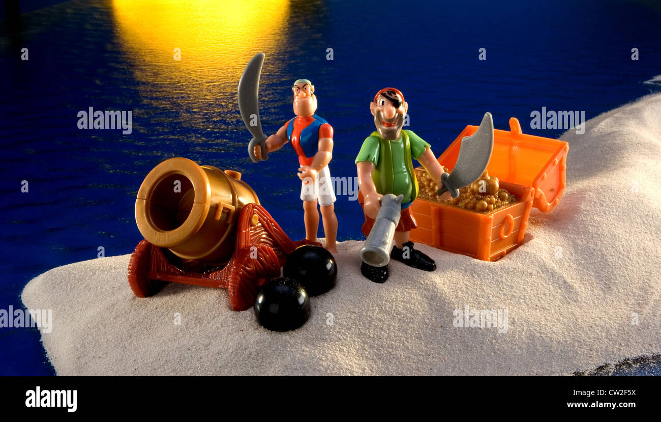 Two plastic pirate on an island Stock Photo