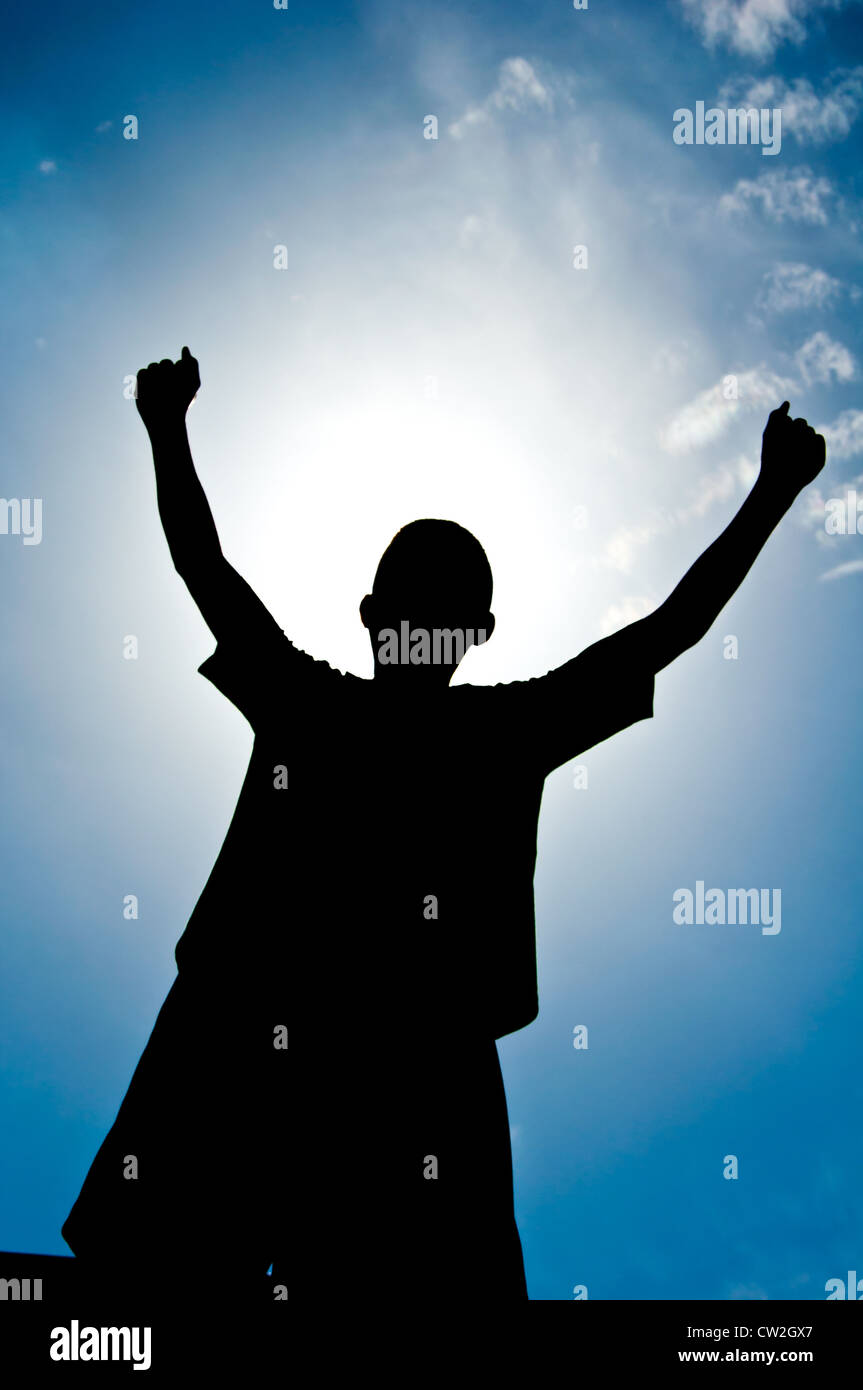 silhouette of boy with medal prize Stock Photo