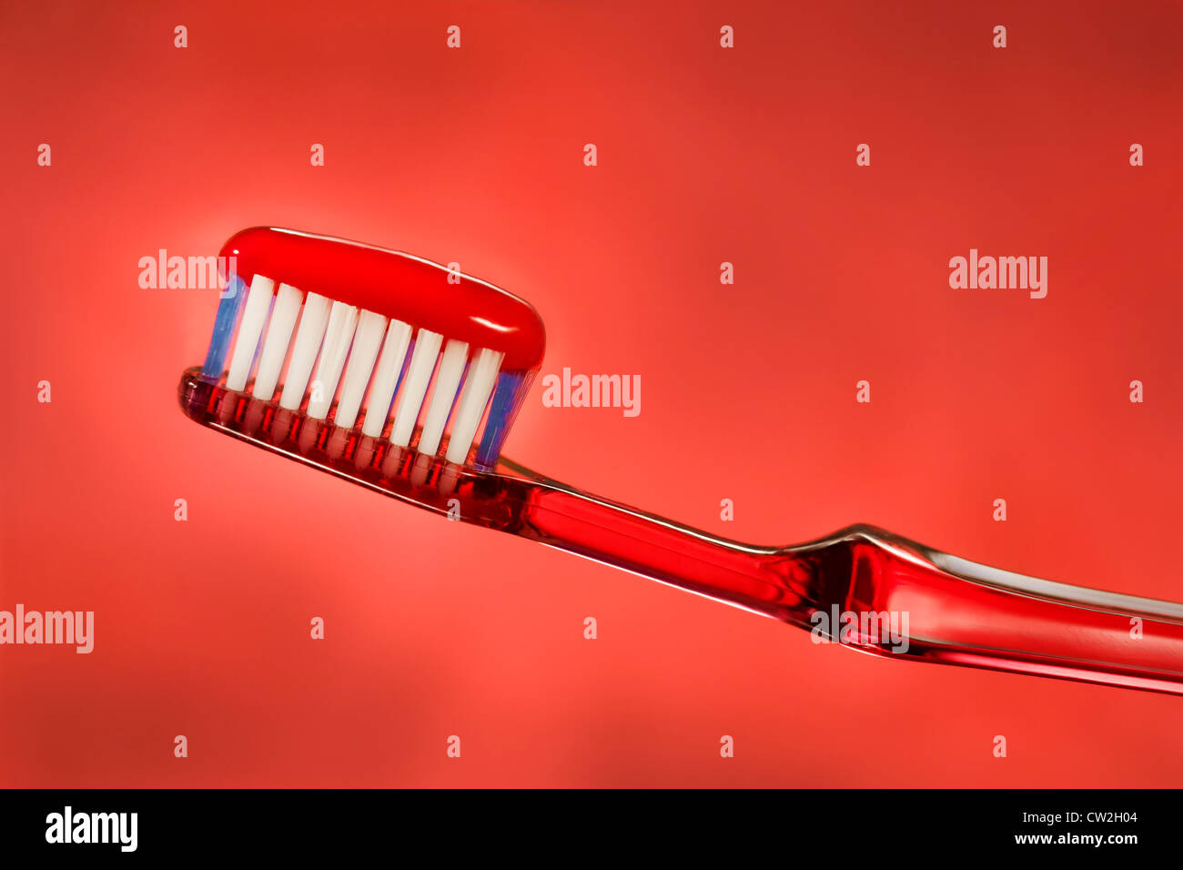 Red Toothpaste on Brush Stock Photo Alamy