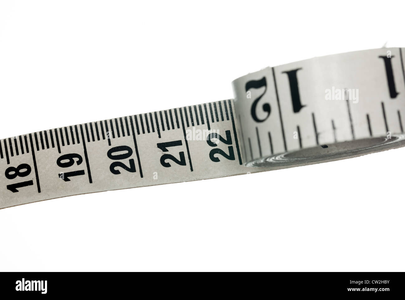Measuring tape with inches made of cloth and isolated against white background Stock Photo
