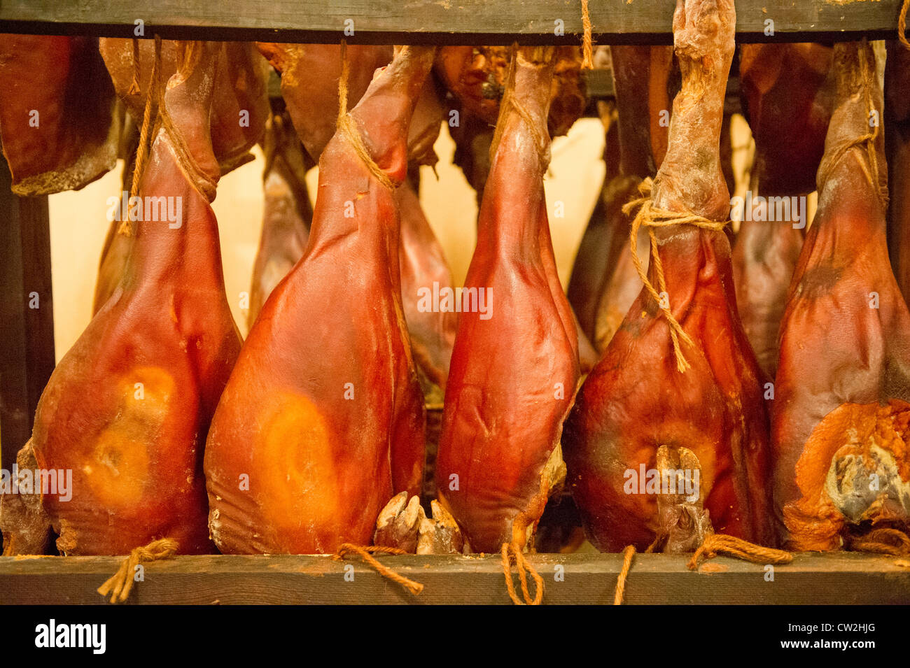 Salt cured hams hanging  Stock Photo