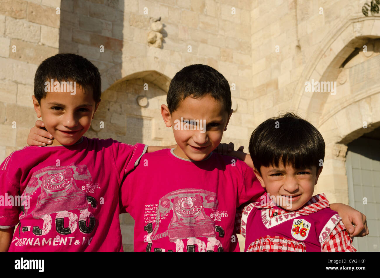 Portrait of 3 young Palestinian boys at Jaffa gate. Jerusalem Old City. israel Stock Photo