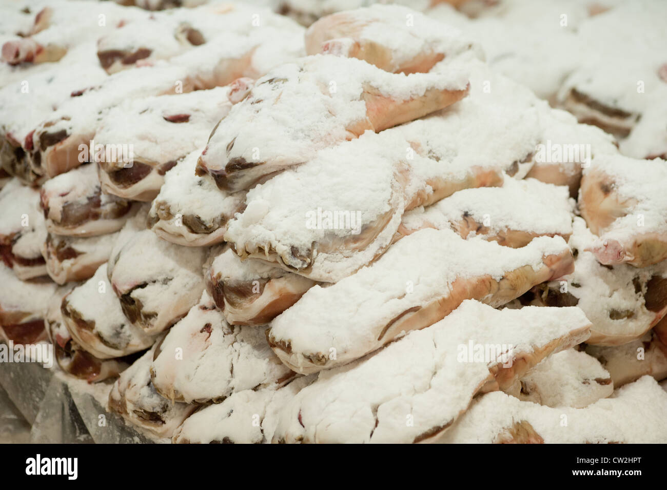 Pile of salt cured hams Stock Photo Alamy
