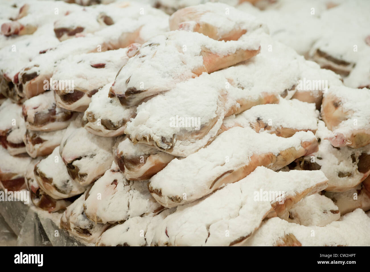 Pile of salt cured hams  Stock Photo