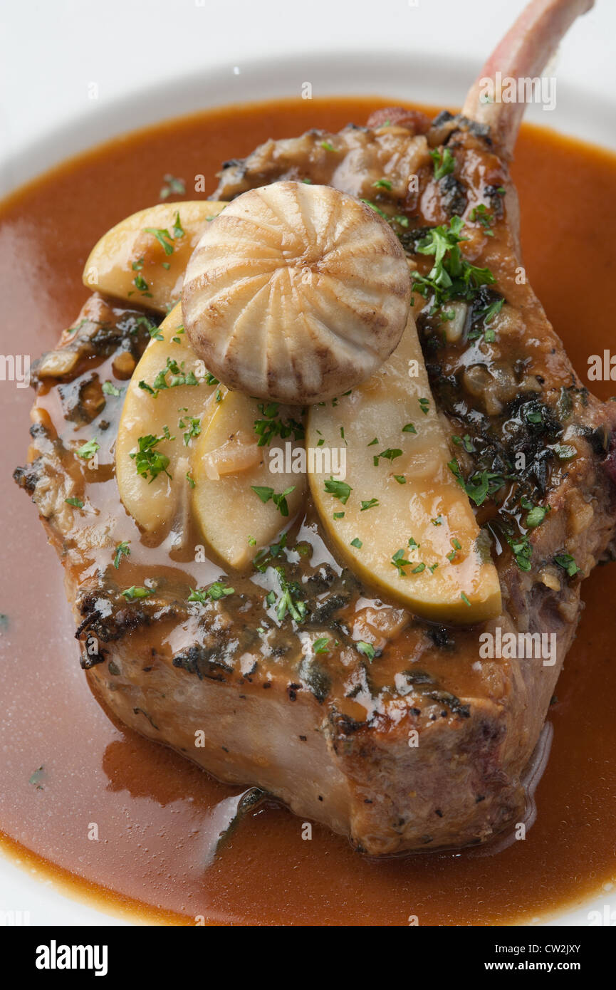 Apple smothered pork chop with medallion mushroom Stock Photo