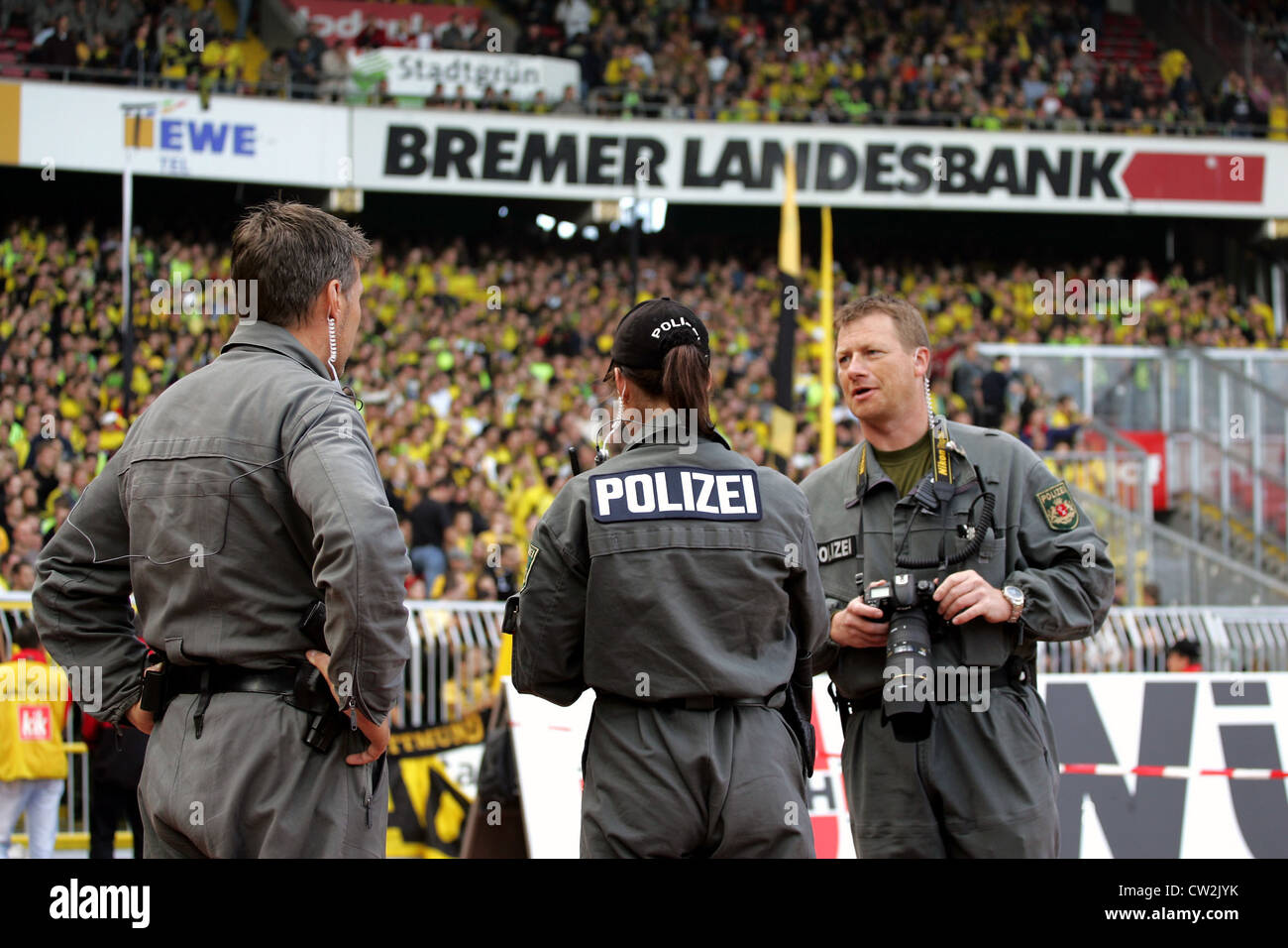 Photographing police on the terraces at the Weser Stadium, Bremen Stock Photo
