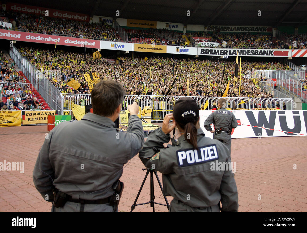 Photographing police on the terraces at the Weser Stadium, Bremen Stock Photo