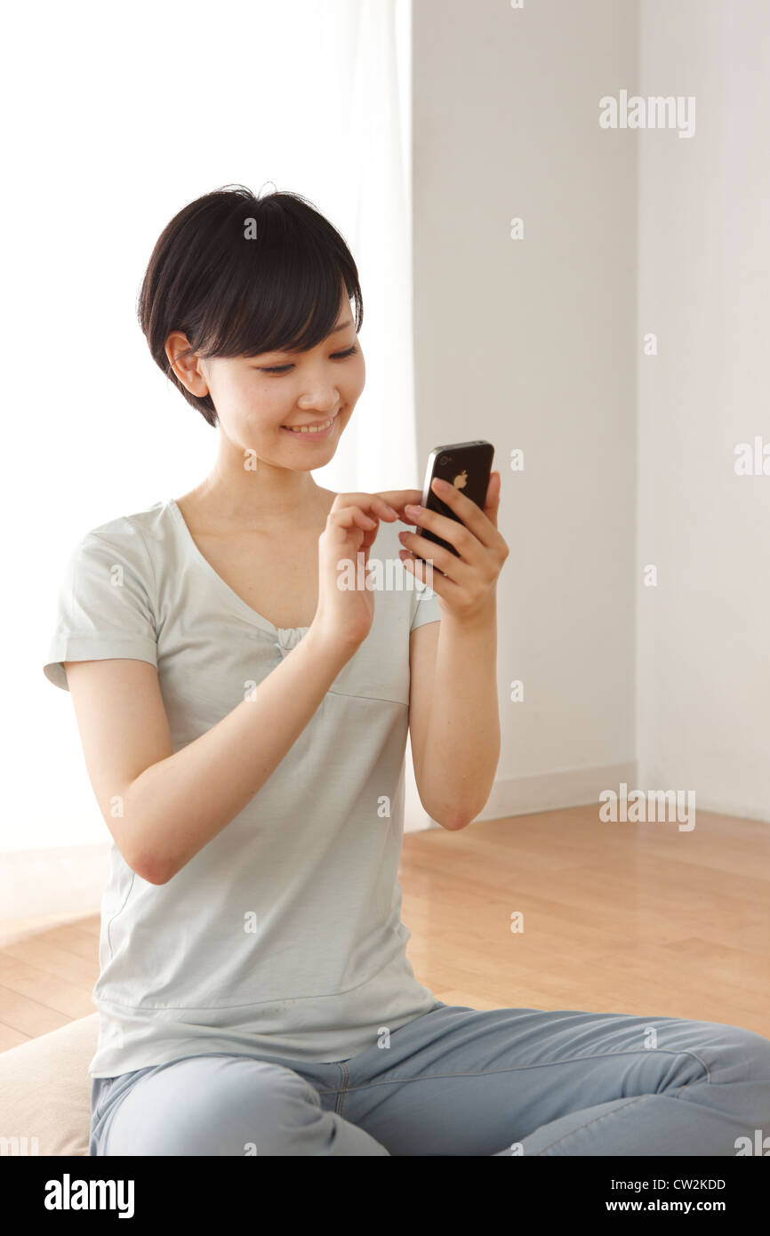 Woman using smart phone Stock Photo