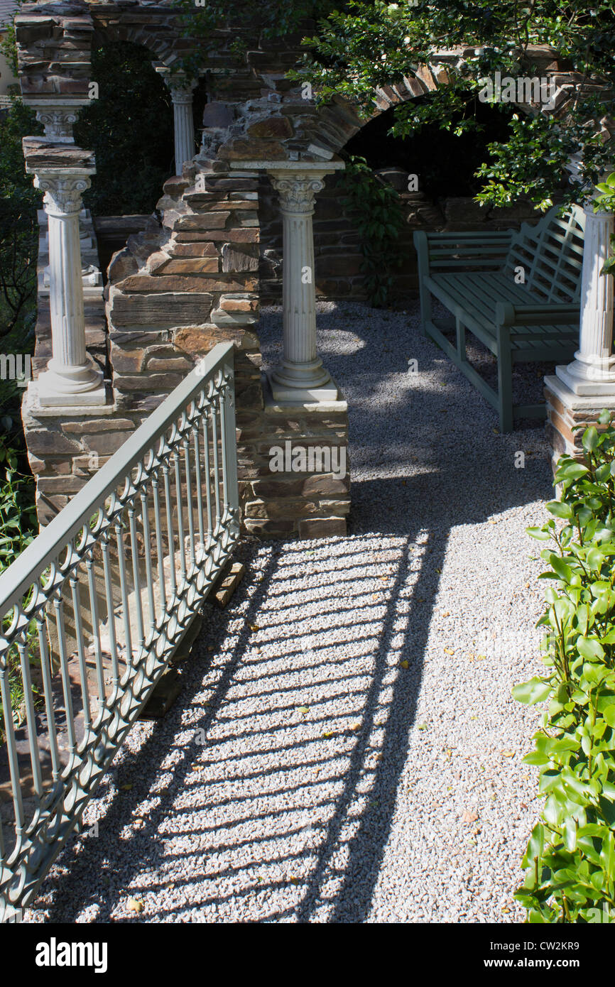 Romanesque retreat in tropical garden Stock Photo