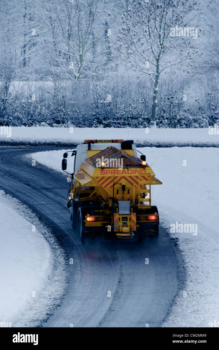 A gritter truck out on the roads in snowy conditions Stock Photo