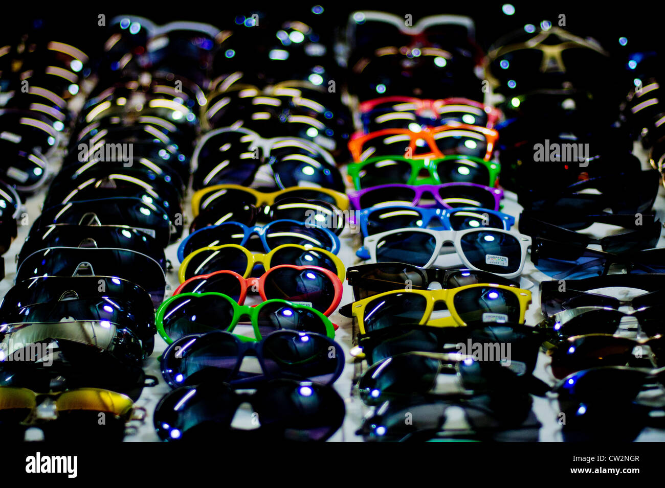 Rows of sunglasses to be sold to tourists Stock Photo
