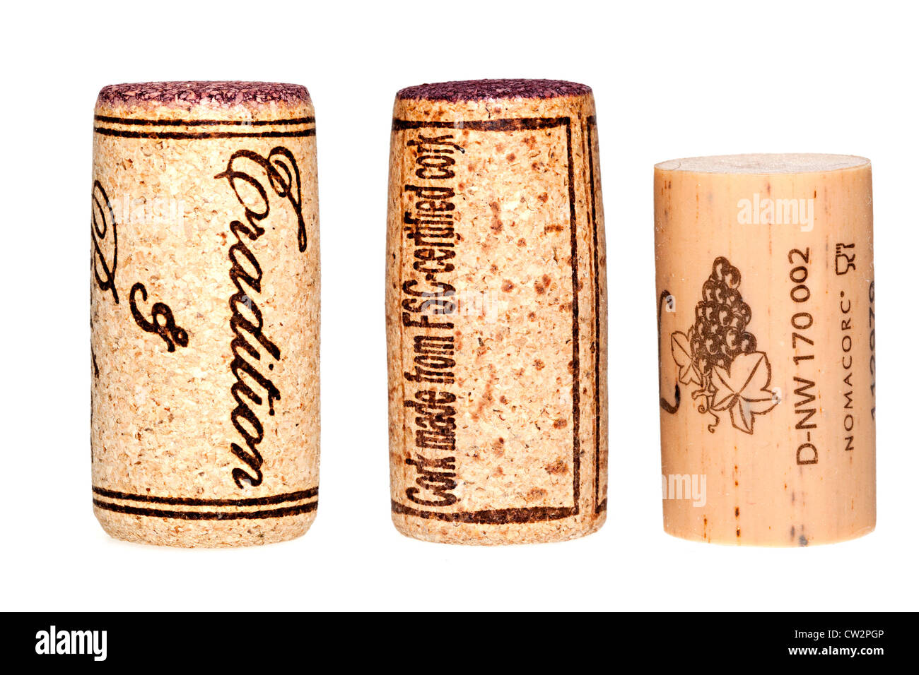Three corks made from natural cork, FSC certified cork and plastic Stock Photo
