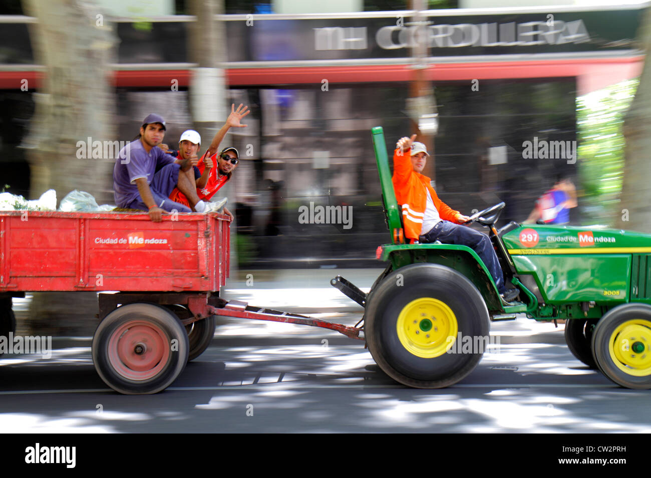 Mendoza Argentina,Avenida Espana,tractor,pulling cart,city worker,workers,public employee,laborer,Hispanic man men male adult adults,wheel,waving,tran Stock Photo