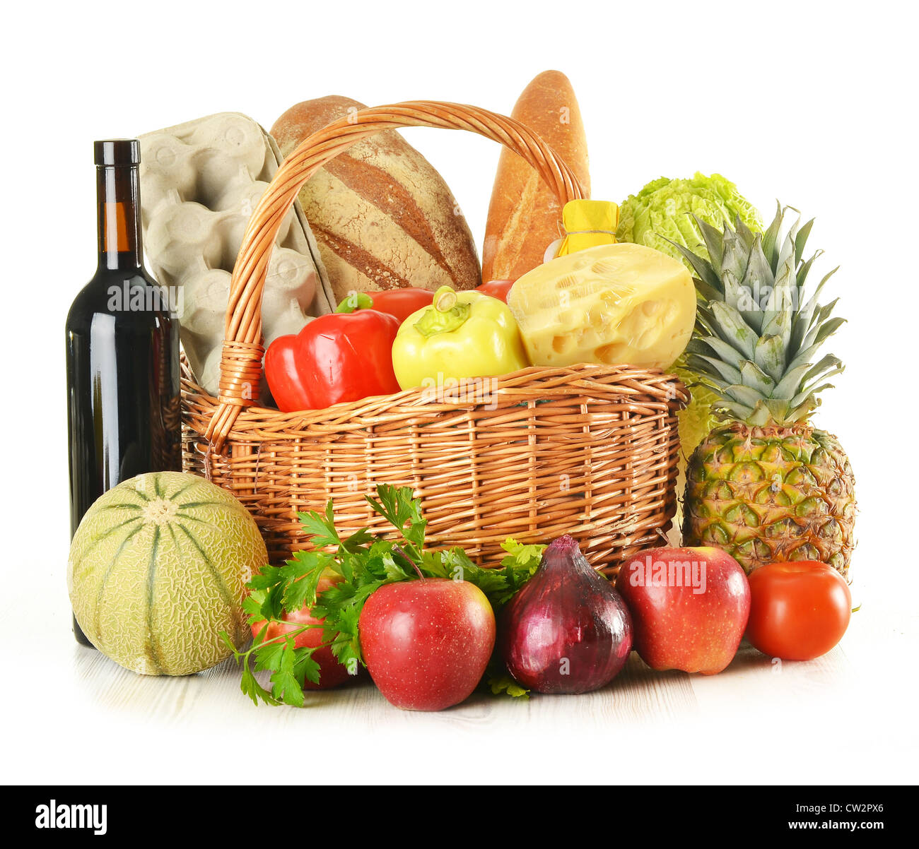 Groceries in wicker basket isolated on white Stock Photo Alamy