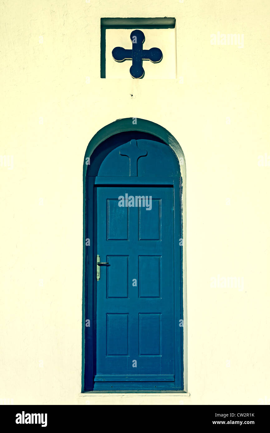 A blue door with a cross Stock Photo