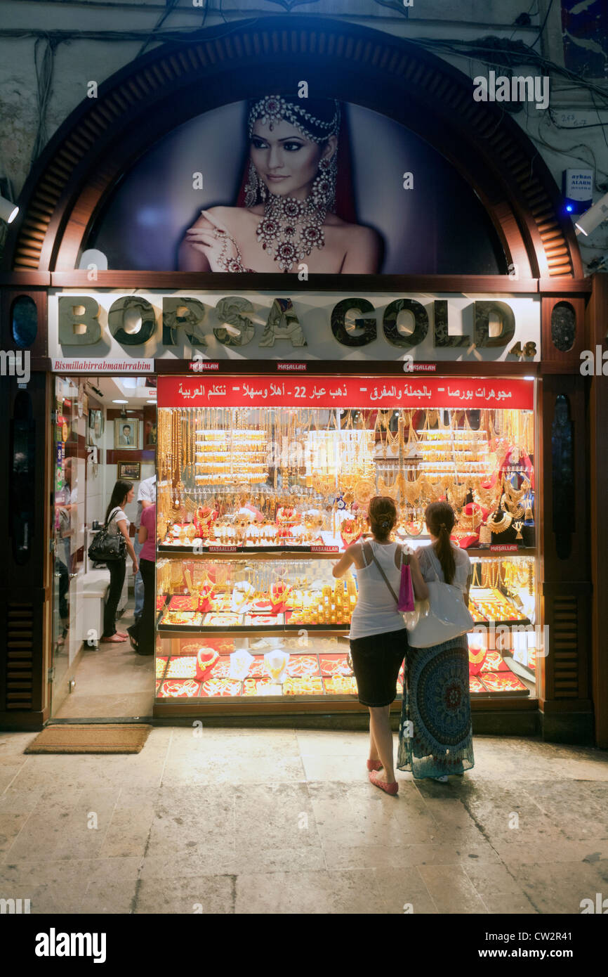 Women looking at gold shop window at the Grand Bazaar covered market in Istanbul, Turkey Stock Photo