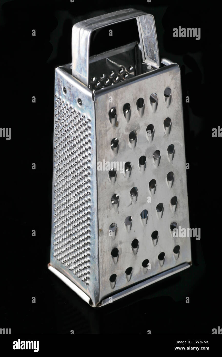 New metal grater isolated on black. Stock Photo