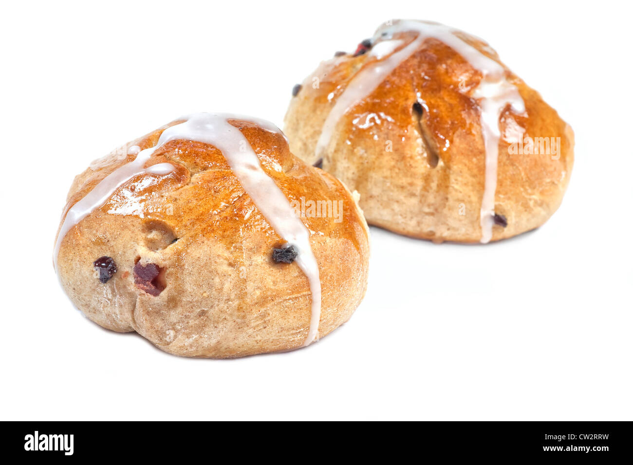A homemade Easter hot cross bun filled with fruit and raisins and