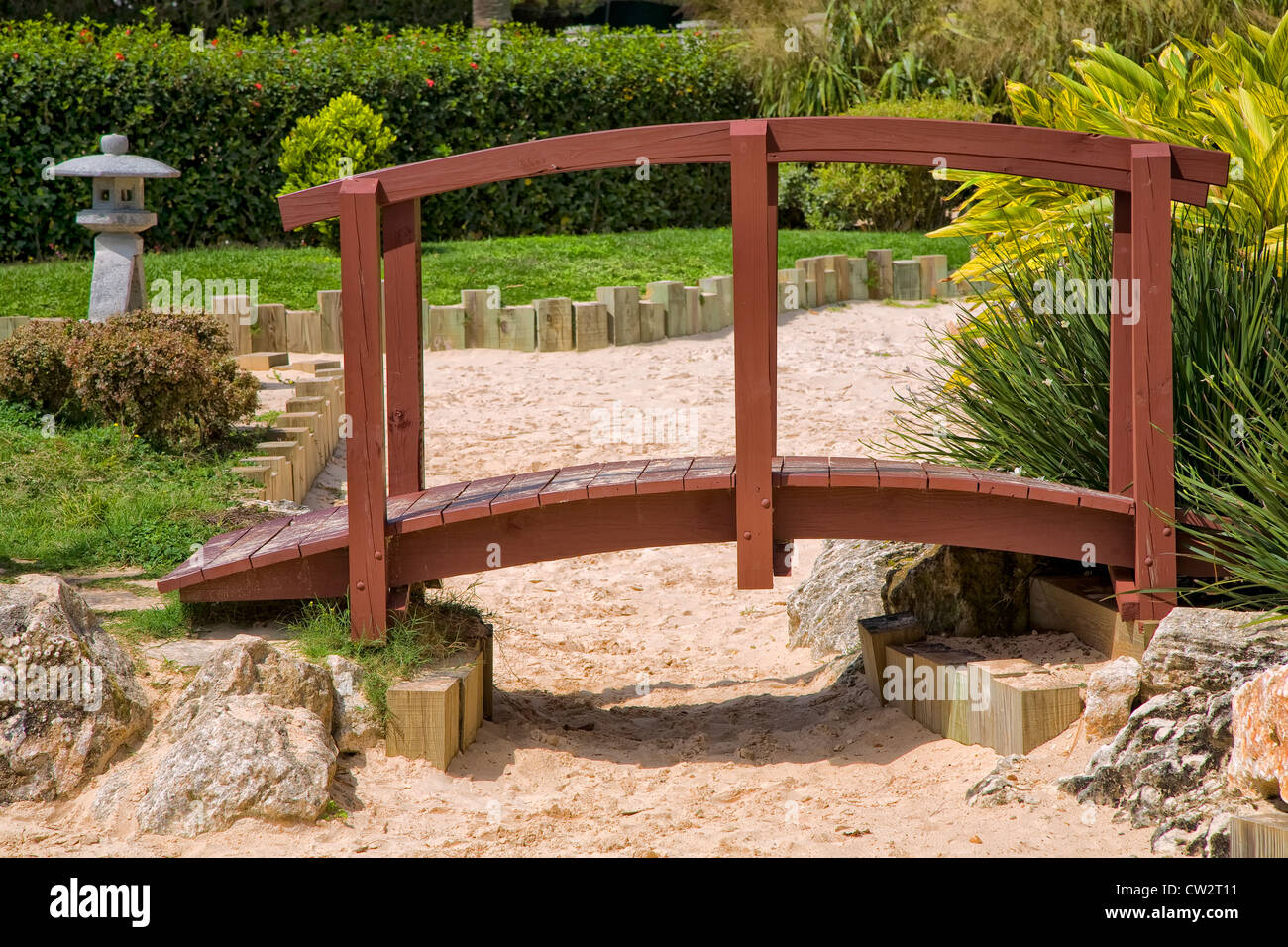 A Japanese garden bridge over a dry river of sand. Stock Photo