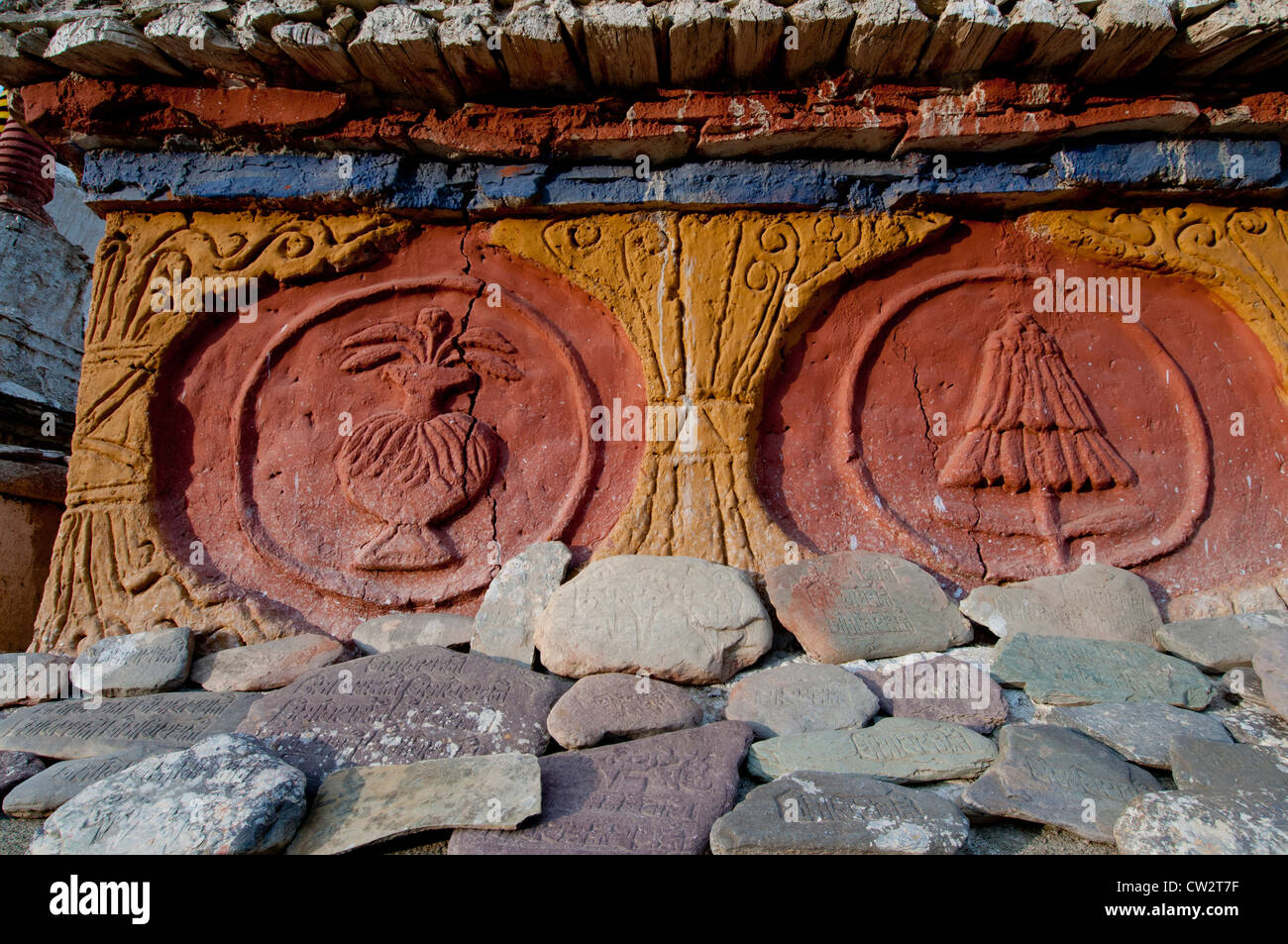 Closeup of the carved bas relief decoration on a chorten at Lamayuru Monastery with carved prayer stones in Ladakh, India Stock Photo