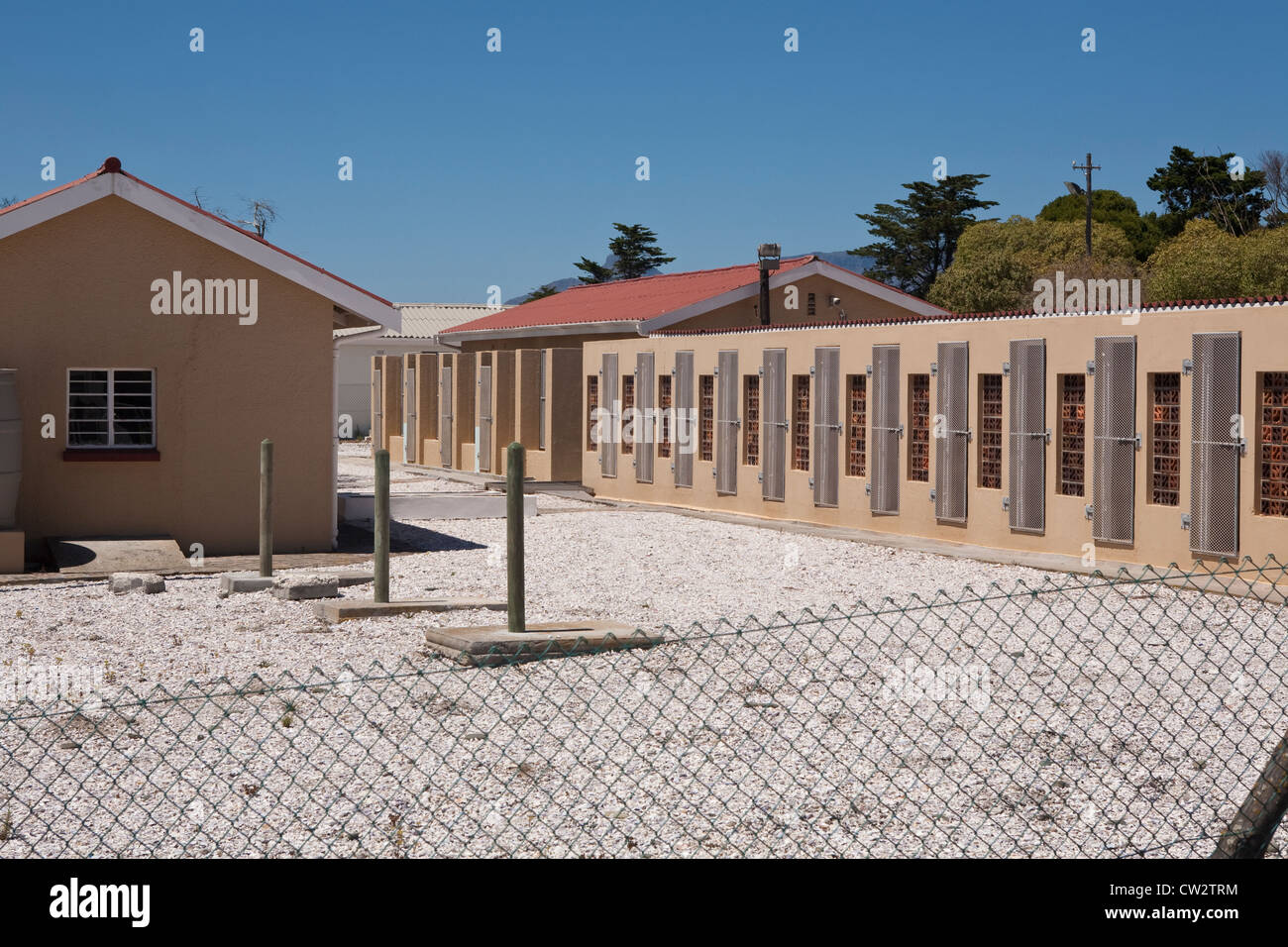 Robben Island Prison grounds where Robert Sobukwe was confined to 24-hour solitary confinement next to the dog kennels buildings Stock Photo