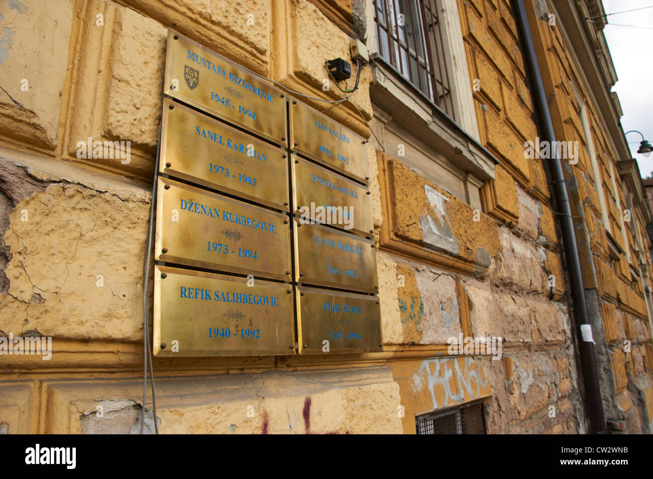 Memorial gold tablet (plates) with victims' names of the 1992-96 Bosnian war on a Sarajevo building Bosnia and Herzegovina Stock Photo