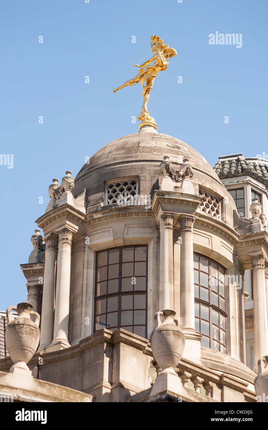 Golden statue of Shakespeare’s Ariel on a dome of the Bank of England, London, England Stock Photo