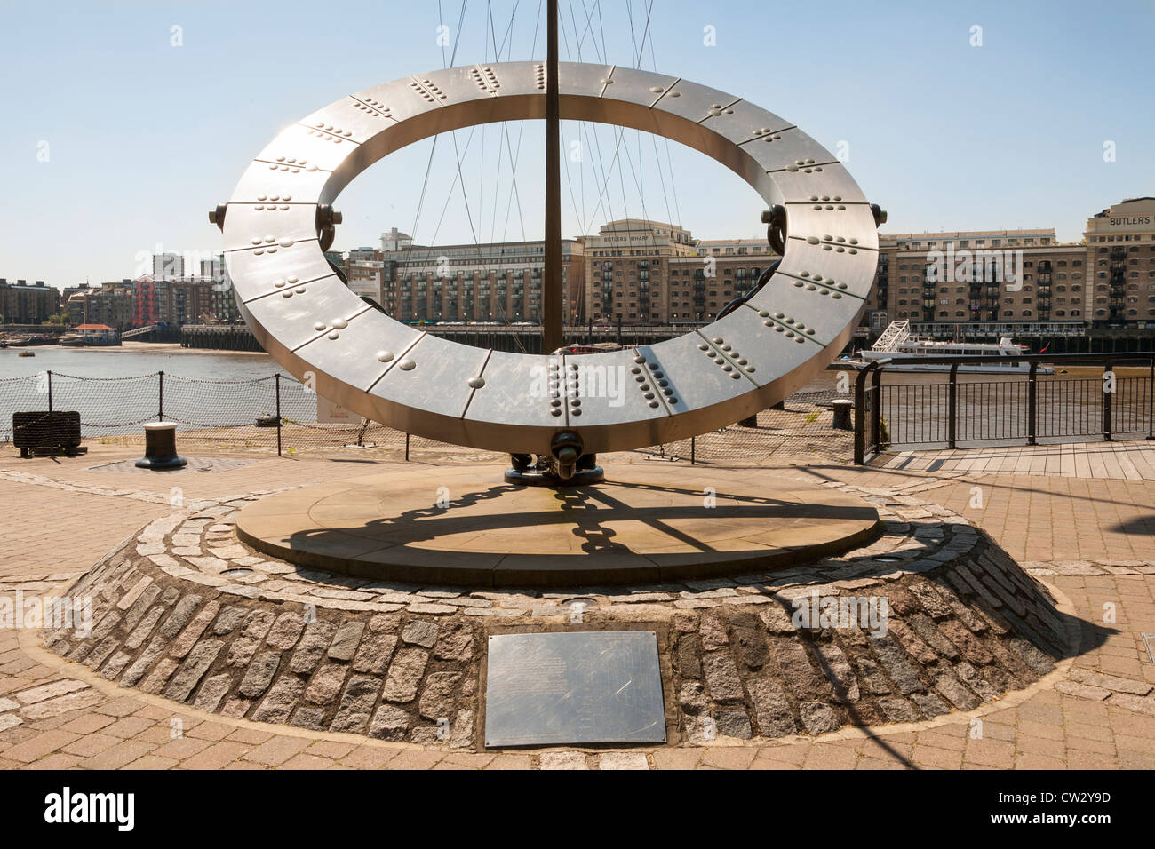 Timepiece Sundial outside Tower Hotel near Tower Bridge and St Katherine Dock, Butlers Wharf behind, London, England Stock Photo