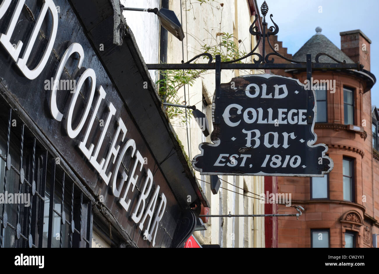 Sign outside the Old College Bar (est.1810, demolished 2021) on Glasgow's High Street on the edge of the Merchant City area. Stock Photo