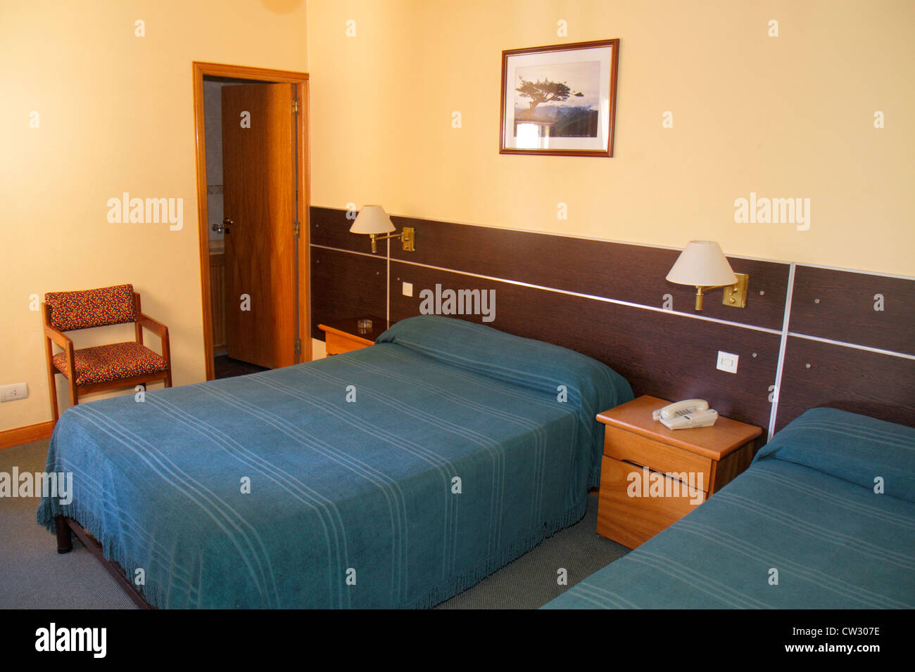 Mendoza Argentina,Avenida San Juan,Hotel Pacifico,lodging,guest room,budget,bed,nightstand,sconce,chair,bedspread,Latin American,South America,Argen12 Stock Photo