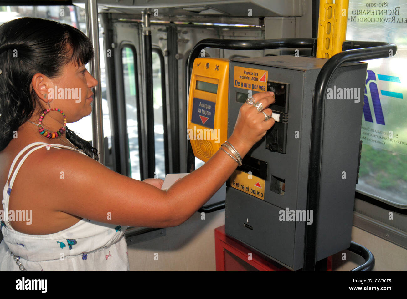 Mendoza Argentina,Villa Nueva,trolleybus,trolley bus,coach,electric vehicle,ally friendly,Hispanic woman female women,farebox,pay,ticket,Latin America Stock Photo