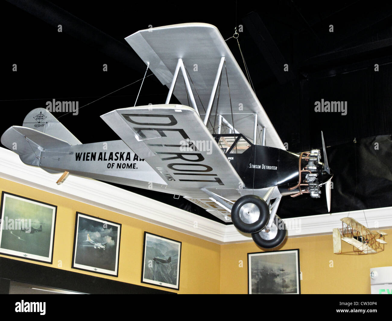 large scale model of Stinson SB-1 Detroiter four-seat biplane with which Alaska Airlines began service Heritage  Flight Museum Stock Photo