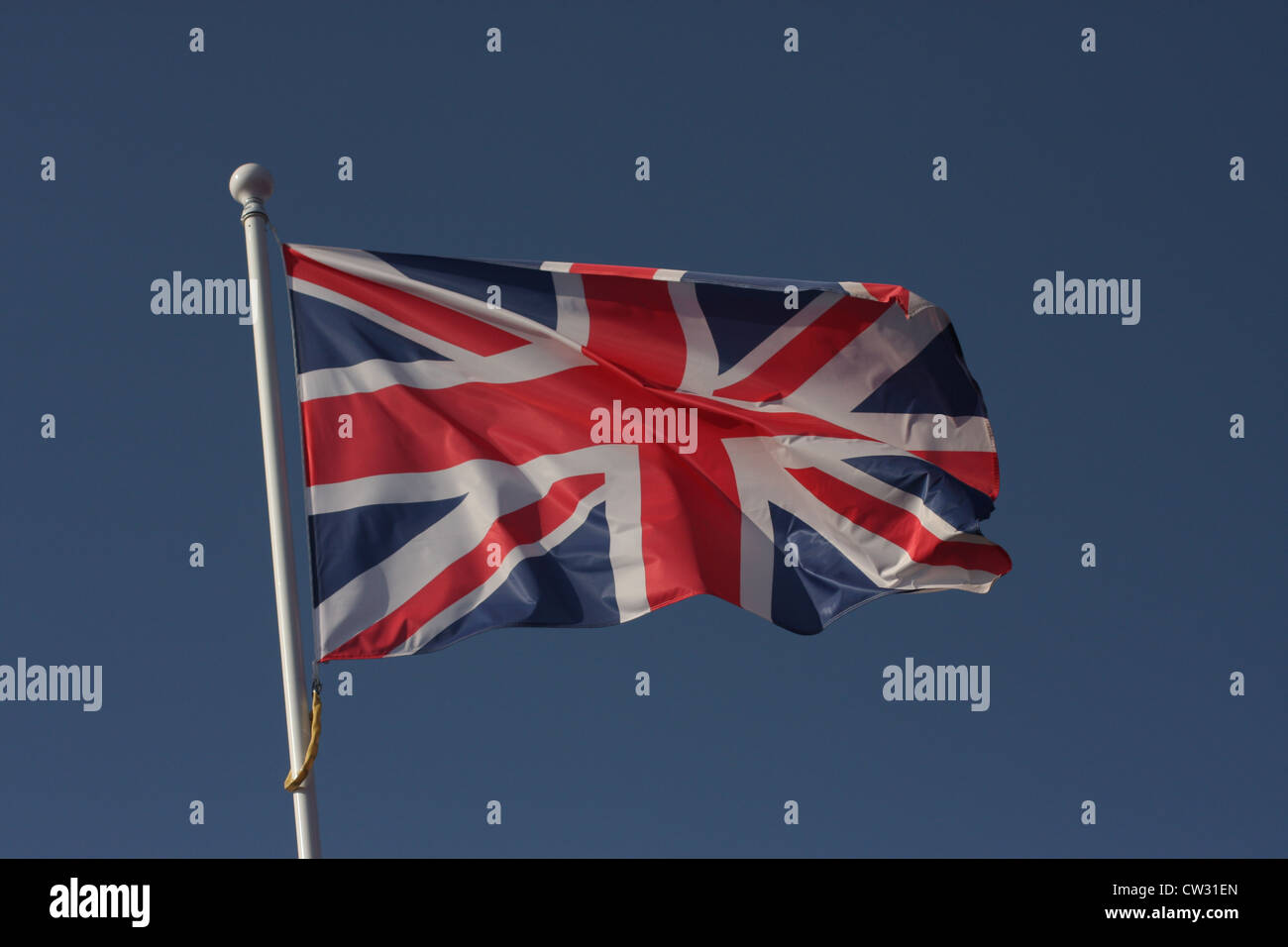 Union Jack flying against a perfect blue sky Stock Photo - Alamy