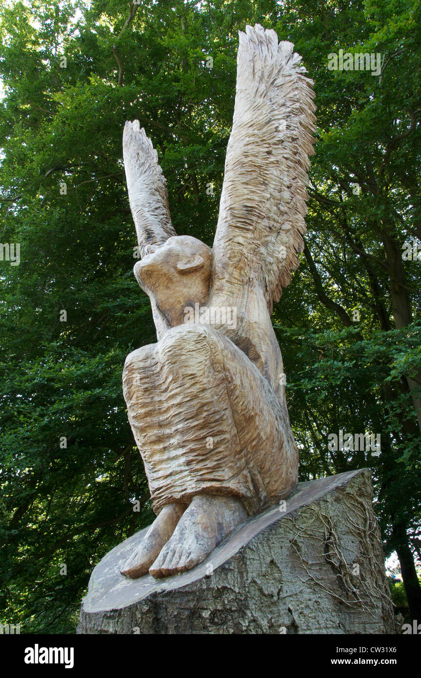 Guardian Angel. A dead Beech tree carved by sculptor Ant Beetlestone into the form of an angel about to take flight. Near Bristol Airport. England, UK Stock Photo