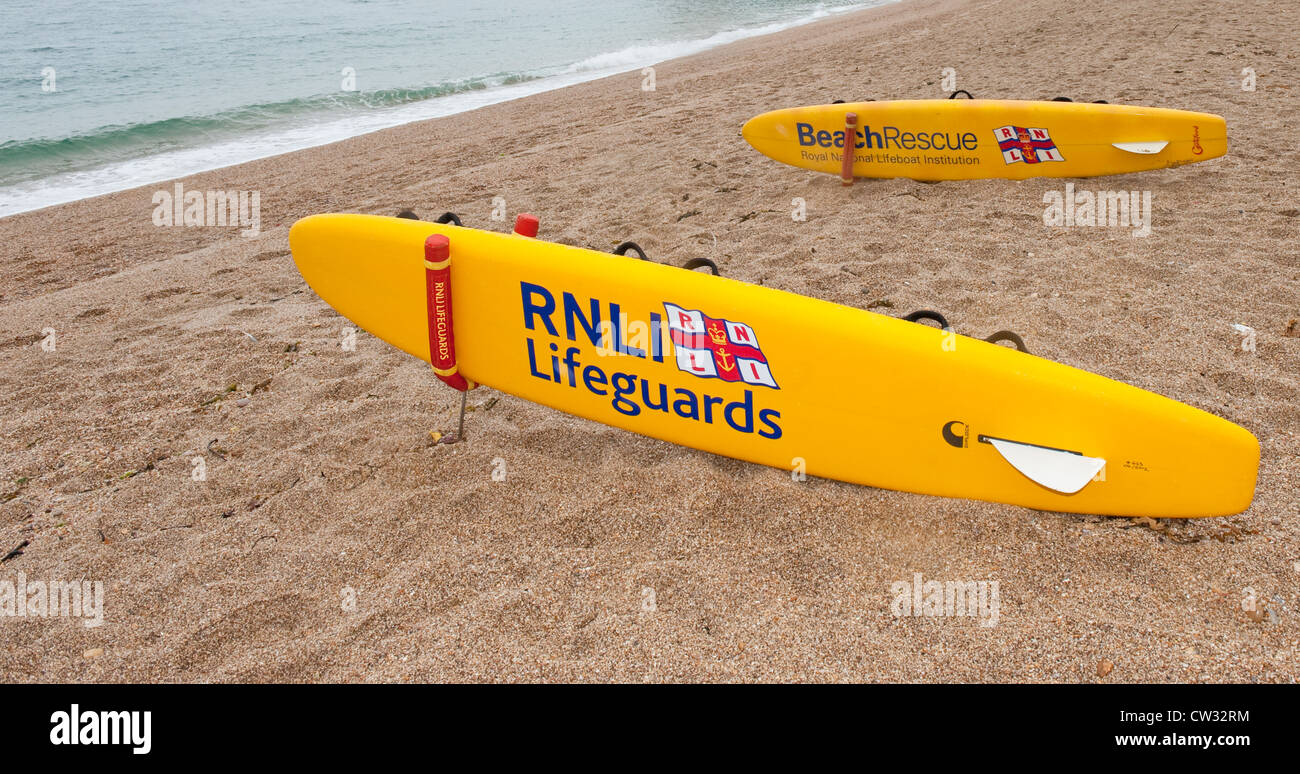 Two RNLI Lifeguard surfboards on Blackpool Sands beach near Stoke Fleming in Devon. Stock Photo