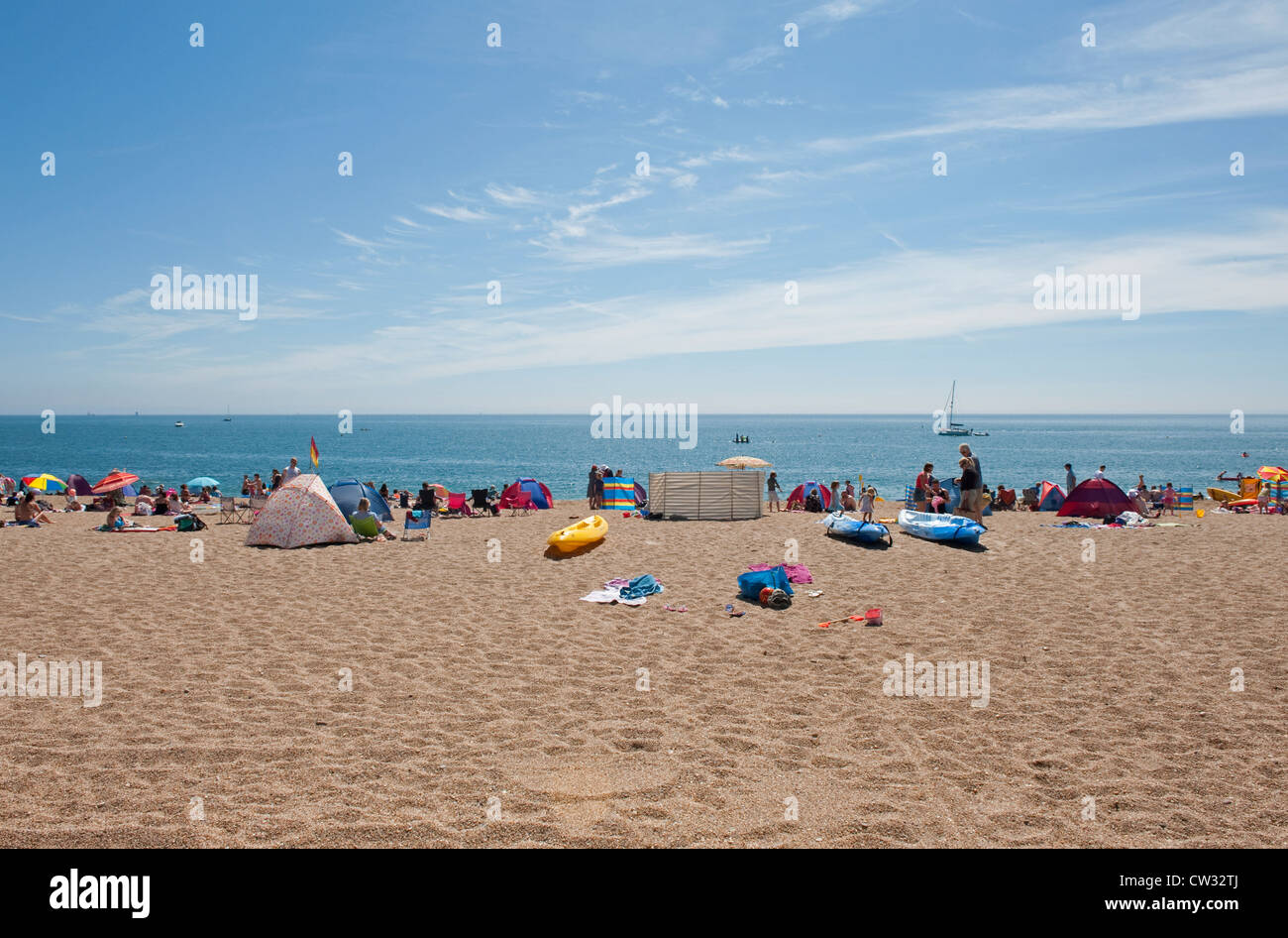 People on Blackpool Sands beach near Stoke Fleming in Devon enjoying the English Summer sun. Stock Photo