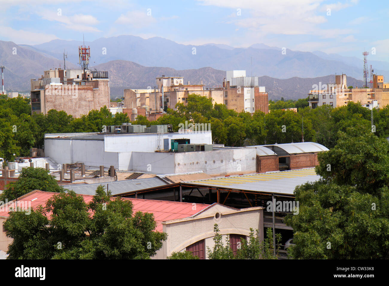 Mendoza Argentina,view from Avenida San Juan hotel,hotels,Andes Mountains,South America mountain range,skyline,building,warehouse,trees,antenna,roof,r Stock Photo