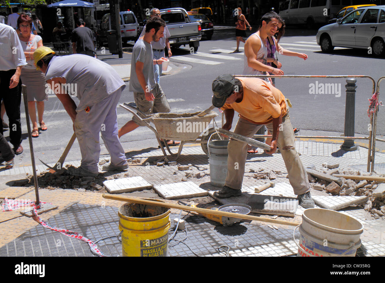 Buenos Aires Argentina,Avenida de Mayo,street,sidewalk repair,urban infrastructure,under new construction site building builder,Hispanic man men male Stock Photo