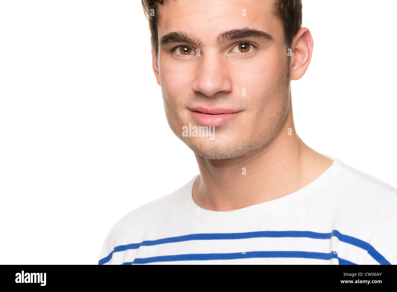 Smiling young man in front of white background Stock Photo - Alamy