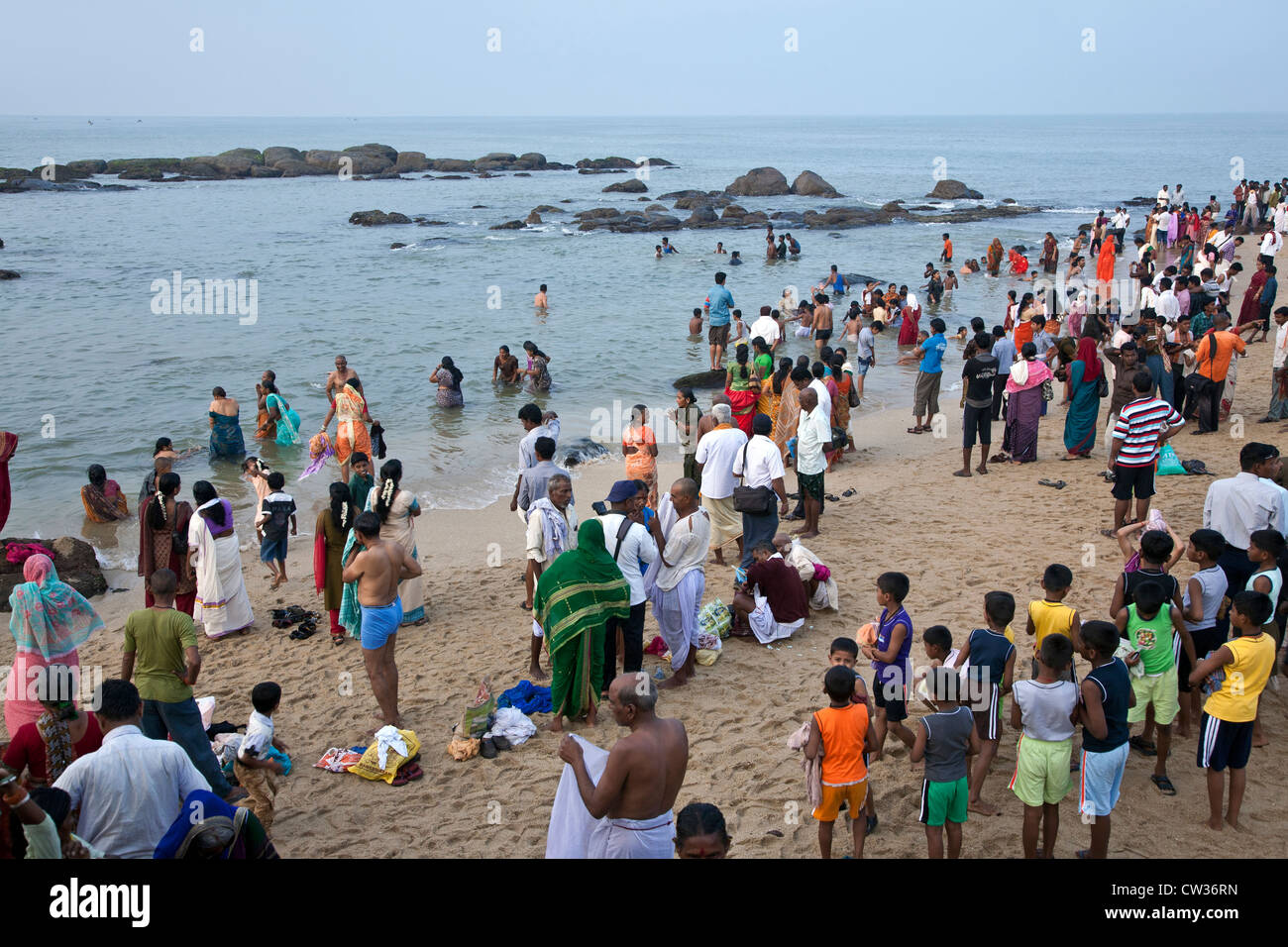 Hindu pilgrims bathing in the sea. Kanyakumari. Cape Comorin. India Stock Photo