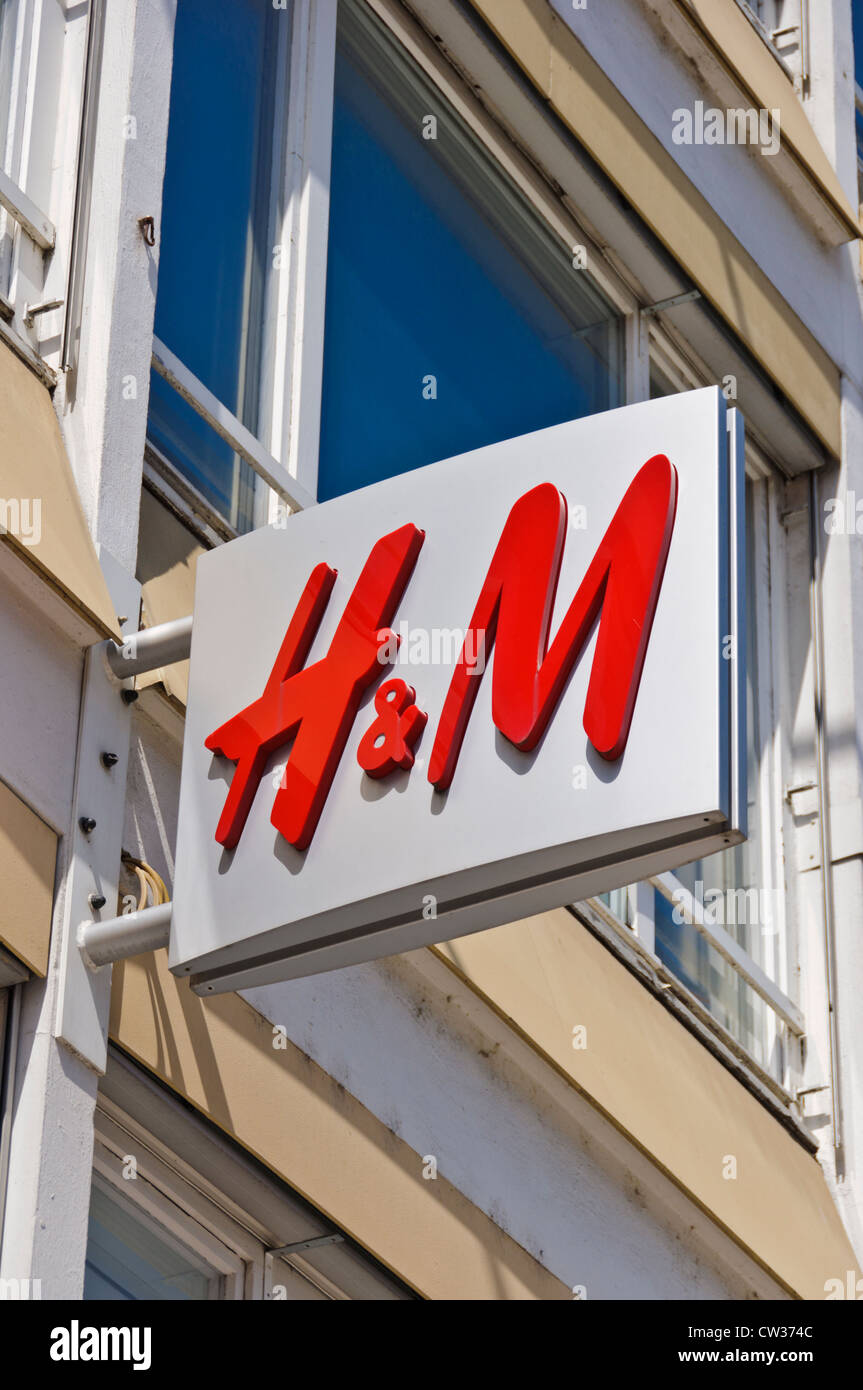 H & M Hennes & Mauritz AB fast-fashion clothing for men, women, teenagers  and children company logo street sign on house front Stock Photo - Alamy