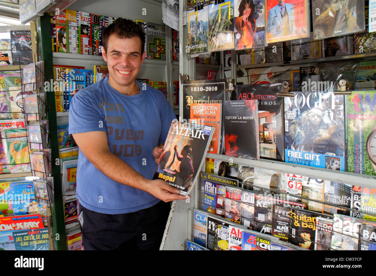 Buenos Aires Argentina,Avenida de Mayo,newsstand,stall,magazines,Hispanic ethnic man men male adult adults,young,blue eyes,work,employee worker worker Stock Photo