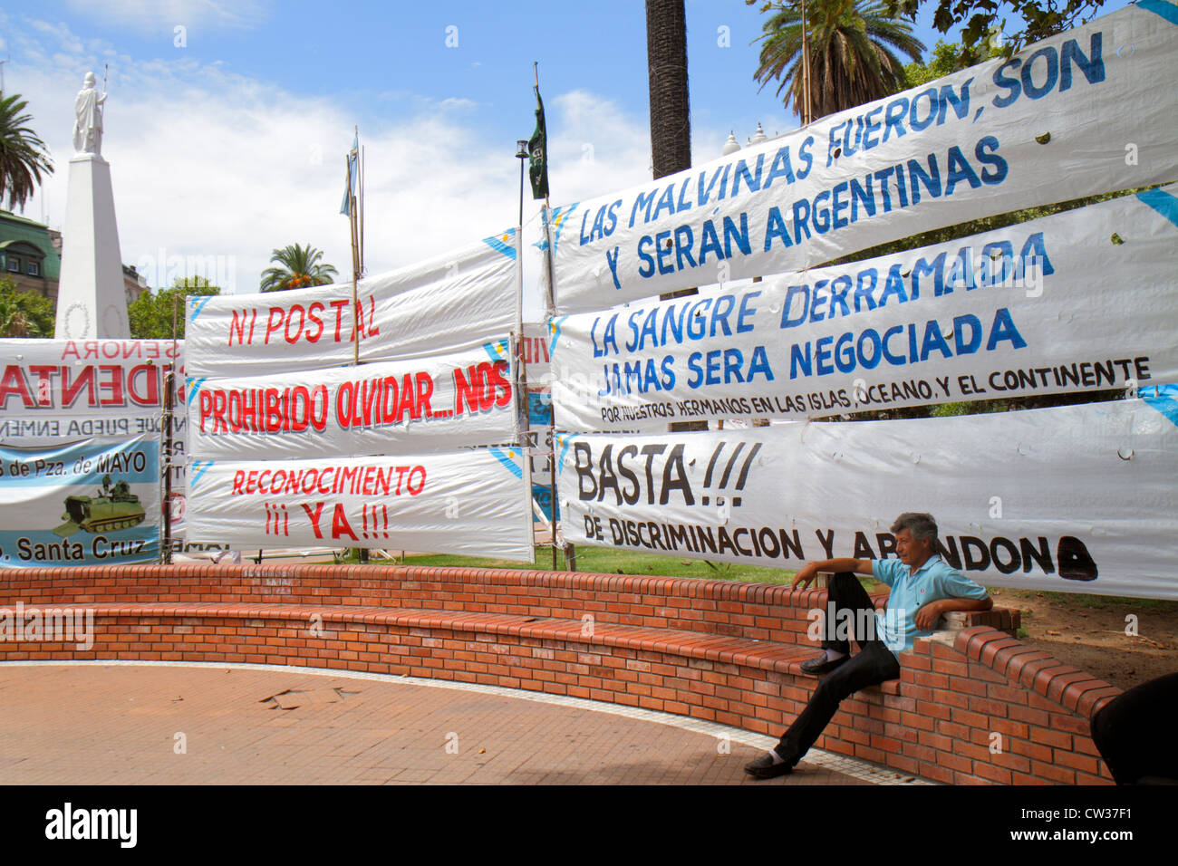 Buenos Aires Argentina,Plaza de Mayo historic main square,political hub,banner,Spanish,language,bilingual,protest,Hispanic man men male adult adults,r Stock Photo
