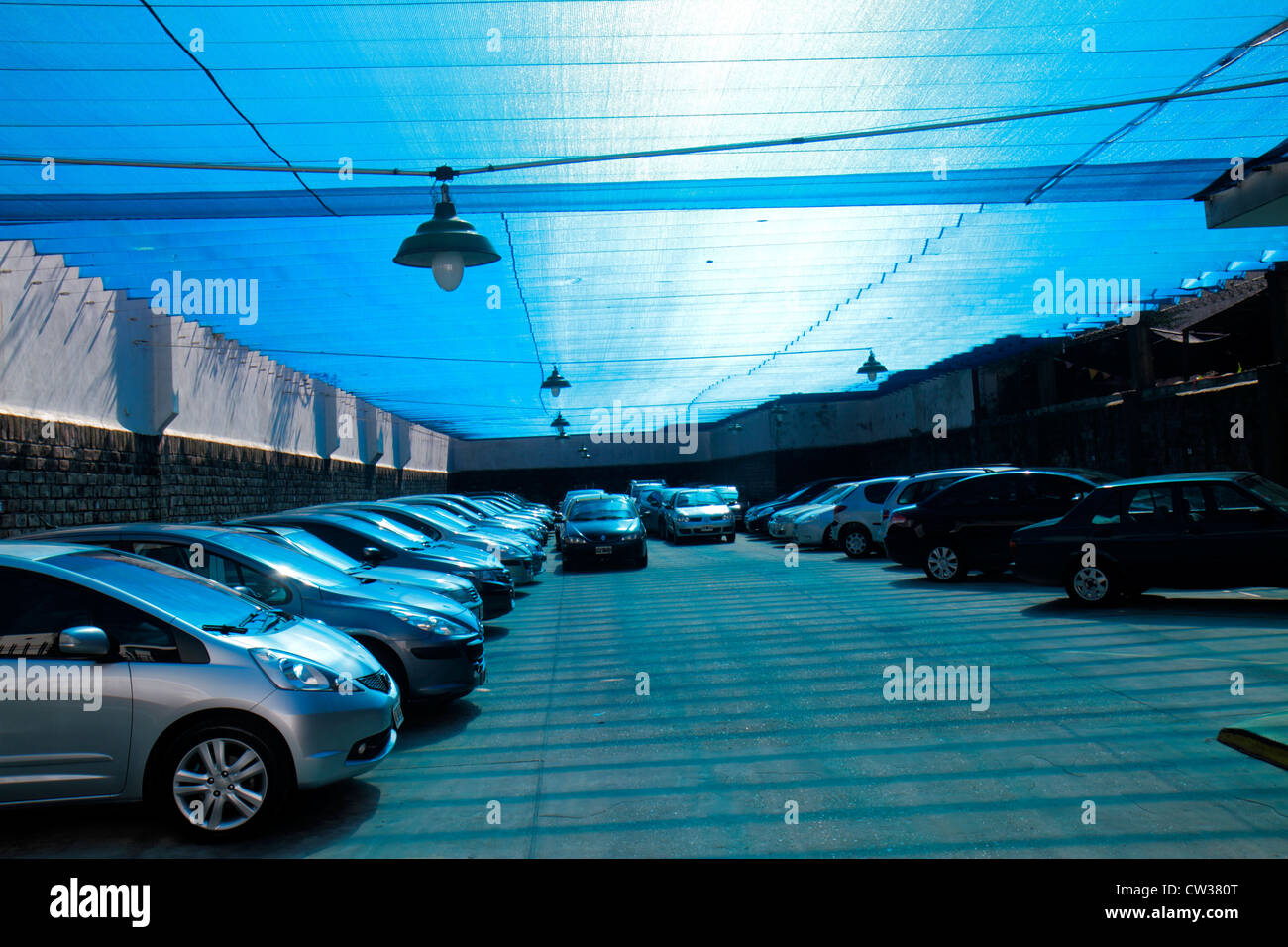 Buenos Aires Argentina,Avenida Defensa,covered parking lot,garage,car cars,blue tarp,space,capacity,visitors travel traveling tour tourist tourism lan Stock Photo