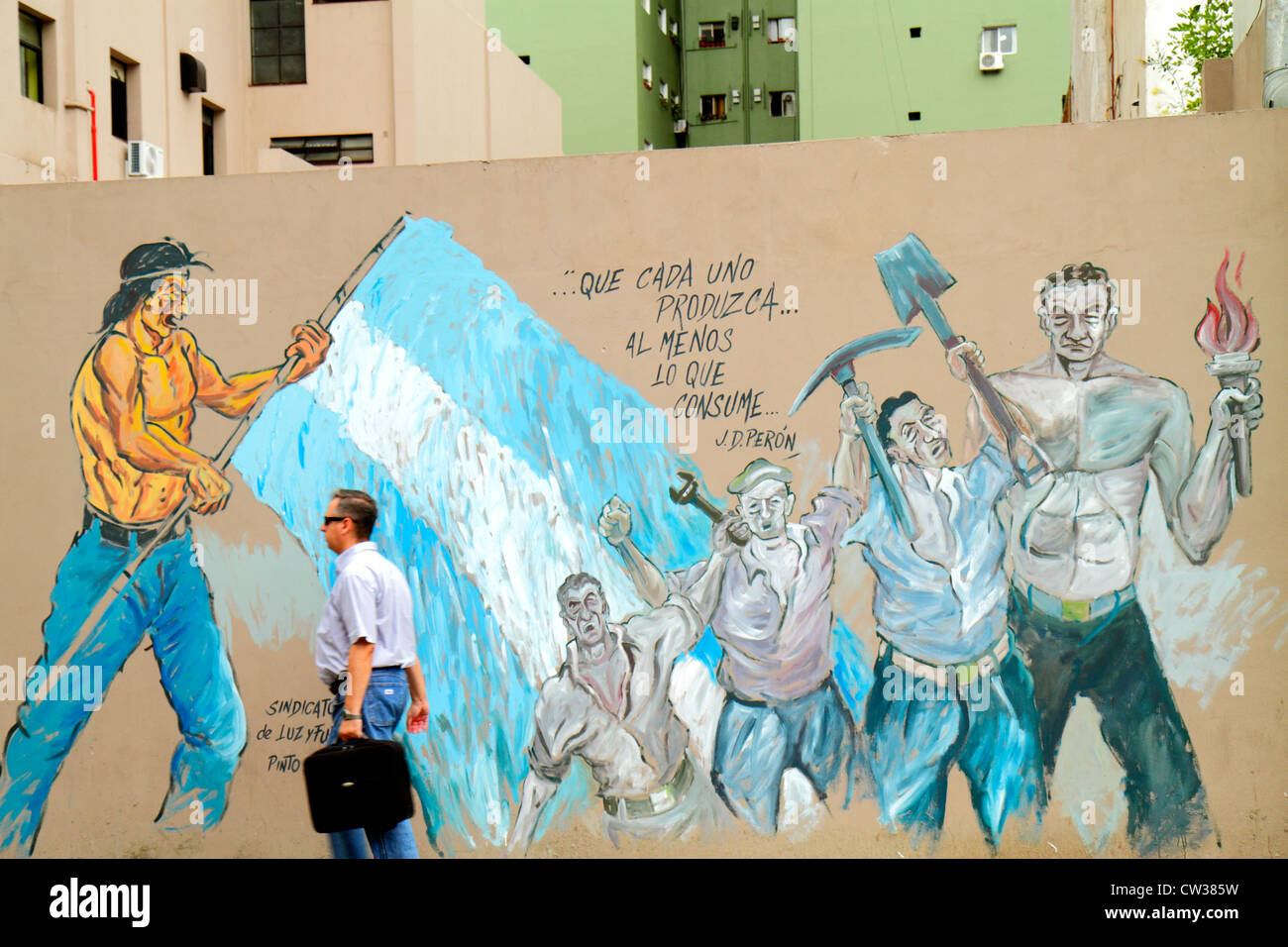 Buenos Aires Argentina,San Telmo,neighborhood,Avenida Peru,mural,street art,Hispanic man men male adult adults,passerby,Peron quote,blue collar worker Stock Photo