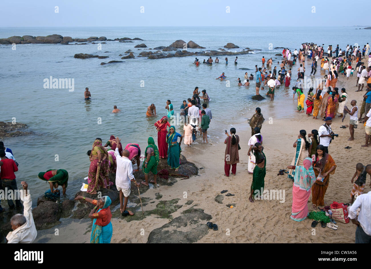 Hindu pilgrims bathing in the sea. Kanyakumari. Cape Comorin. India Stock Photo