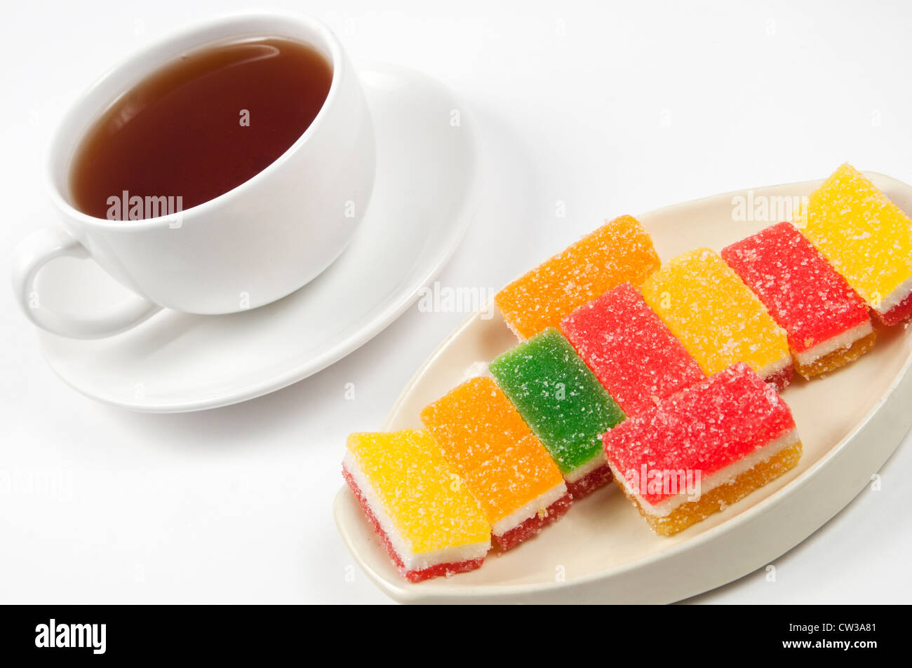 fruit-paste candies and a cup of tea Stock Photo